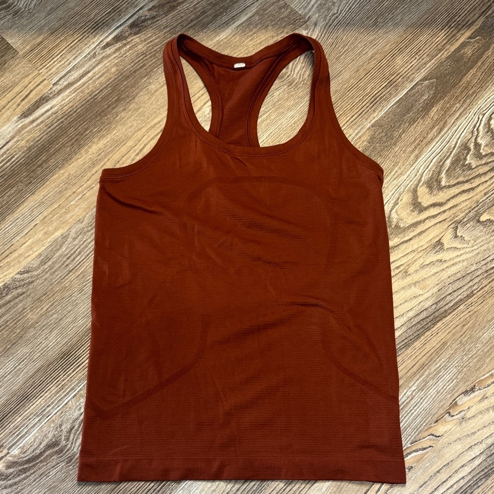 Lululemon Swifty Tech Hip length Tank Size 6 rust orange color